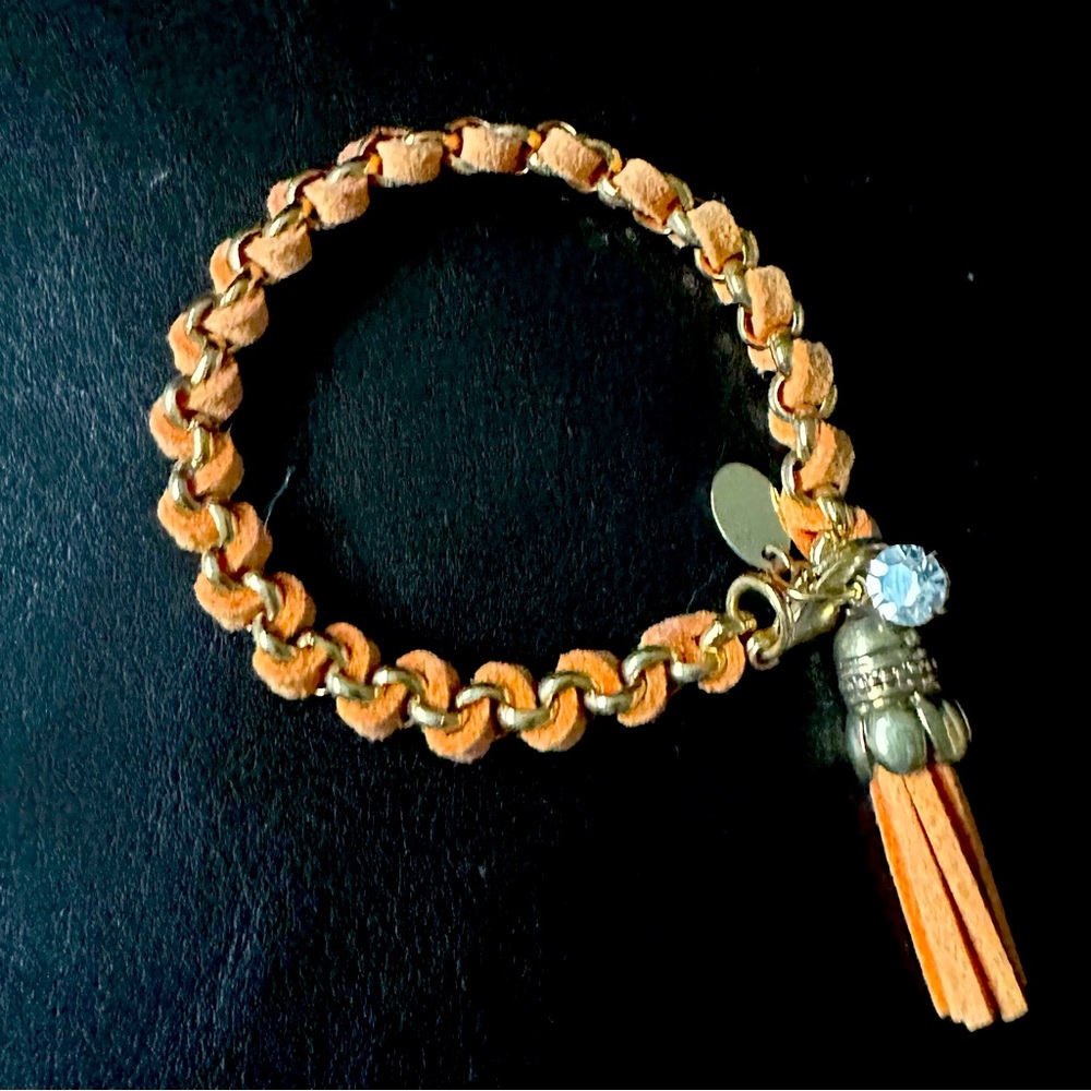 Braided Orange Leather Bracelet with Tassel Charm and Gold Accents